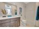 Bathroom with a full bathtub and shower, modern cabinets, decorative towels and artwork at 350 Gandara St, Las Vegas, NV 89138