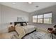 Cozy bedroom featuring a comfortable queen bed, two side tables with lamps, and an exterior view at 350 Gandara St, Las Vegas, NV 89138