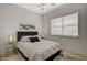 This bedroom features a large window, soft natural light, stylish lamps, and comfortable modern decor at 350 Gandara St, Las Vegas, NV 89138
