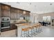 Beautiful kitchen features stainless steel appliances, granite countertops, and a large center island with seating at 350 Gandara St, Las Vegas, NV 89138