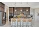 Modern kitchen with granite countertops, stainless steel appliances, and stylish bar stool seating at 350 Gandara St, Las Vegas, NV 89138