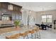 Spacious kitchen with granite countertops, dark wood cabinets, and stylish pendant lighting fixtures at 350 Gandara St, Las Vegas, NV 89138