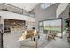Bright, open-concept living room features soaring ceilings, natural light, and access to the backyard at 350 Gandara St, Las Vegas, NV 89138