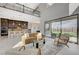 Bright, open-concept living space with high ceilings and seamless indoor-outdoor flow to the backyard at 350 Gandara St, Las Vegas, NV 89138
