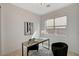 Well-lit home office featuring modern desk, accent chair and bright windows at 350 Gandara St, Las Vegas, NV 89138