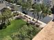 An aerial view of a residential area featuring well-maintained green spaces, sidewalks, and mature trees at 355 Gracious Way, Henderson, NV 89011
