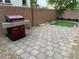 Paver patio with synthetic grass featuring a stainless steel grill, surrounded by a block wall at 355 Gracious Way, Henderson, NV 89011