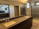 Bathroom featuring a double vanity with stone countertop and glass-enclosed shower at 355 Gracious Way, Henderson, NV 89011