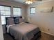 Cozy bedroom featuring neutral tones, natural light, ceiling fan, and a comfortable queen-size bed at 355 Gracious Way, Henderson, NV 89011