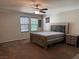 Inviting bedroom showcasing a custom bed frame and carpeted flooring at 355 Gracious Way, Henderson, NV 89011