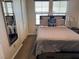 Bedroom with a comfortable Queen bed, a full-length mirror, and two windows at 355 Gracious Way, Henderson, NV 89011