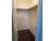 Walk-in closet featuring carpet flooring and a wood storage rod at 355 Gracious Way, Henderson, NV 89011