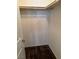Walk-in closet featuring carpet flooring and a wood storage rod at 355 Gracious Way, Henderson, NV 89011