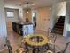 Open dining area showcasing kitchen island and staircase access at 355 Gracious Way, Henderson, NV 89011