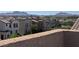 An elevated exterior view of homes with varied architectural styles and mountain views in the distance at 355 Gracious Way, Henderson, NV 89011