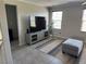 Bright Gathering room featuring a TV and comfortable ottoman at 355 Gracious Way, Henderson, NV 89011