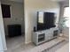 Bright Gathering room featuring a TV and ample storage at 355 Gracious Way, Henderson, NV 89011