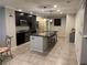 A view of a kitchen featuring granite countertops, stainless steel appliances, and ample cabinet space at 355 Gracious Way, Henderson, NV 89011