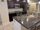 A view of a kitchen featuring granite countertops, stainless steel appliances, and ample cabinet space at 355 Gracious Way, Henderson, NV 89011