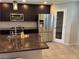 Modern kitchen featuring stainless steel appliances and dark cabinets at 355 Gracious Way, Henderson, NV 89011