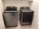 Modern laundry room featuring Samsung washer and dryer appliances at 355 Gracious Way, Henderson, NV 89011