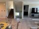 Open-concept living area with staircase and view into Gathering room at 355 Gracious Way, Henderson, NV 89011