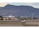 Rooftop view showing the city with a backdrop of a scenic mountain landscape at 355 Gracious Way, Henderson, NV 89011