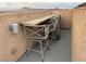 Cozy rooftop bar area with a high-top table and chairs, perfect for outdoor entertaining at 355 Gracious Way, Henderson, NV 89011
