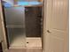Bathroom highlighting glass enclosed shower featuring a shower head and gray stone-look tile at 355 Gracious Way, Henderson, NV 89011
