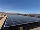 This home features roof-mounted solar panels for energy efficiency and cost savings at 355 Gracious Way, Henderson, NV 89011