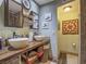 Rustic bathroom with dual vessel sinks, wooden countertop, and decorative accents at 438 Las Casitas Way, Las Vegas, NV 89121