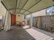 Outdoor deck featuring a shaded canopy, wooden flooring and a cozy seating area at 438 Las Casitas Way, Las Vegas, NV 89121