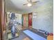Home exercise room with mirrored closet, hardwood floor, exercise mat, and ceiling fan at 438 Las Casitas Way, Las Vegas, NV 89121