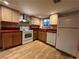 Traditional kitchen with laminate floors and essential appliances, offering functionality and style at 438 Las Casitas Way, Las Vegas, NV 89121
