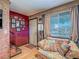 Cozy living room with front door and view of the front yard at 438 Las Casitas Way, Las Vegas, NV 89121