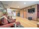 Open concept living room with kitchen view, hardwood floors, and comfortable seating at 438 Las Casitas Way, Las Vegas, NV 89121