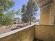 View from the patio looking out at the community green space and the neighborhing tan townhomes at 438 Las Casitas Way, Las Vegas, NV 89121