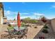 Inviting backyard with outdoor dining set, xeriscaping and pristine gravel at 4505 Meline Ave, North Las Vegas, NV 89084