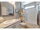 Well-lit bathroom with a granite countertop sink and a shower-tub combination at 4505 Meline Ave, North Las Vegas, NV 89084