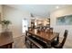 Inviting dining room features a modern table set with seating for six people at 4505 Meline Ave, North Las Vegas, NV 89084