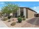 Beautiful single-story home featuring desert landscaping with rock groundcover and a brick driveway at 4505 Meline Ave, North Las Vegas, NV 89084