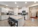 Well-equipped kitchen with stainless steel appliances, a granite-topped island, and ample cabinet space at 4505 Meline Ave, North Las Vegas, NV 89084
