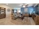 Comfortable living room with tile flooring, stylish decor, and access to the dining area at 4505 Meline Ave, North Las Vegas, NV 89084