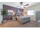 Spacious main bedroom with lots of light, ceiling fan, and tasteful modern decor at 4505 Meline Ave, North Las Vegas, NV 89084