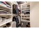 Well-organized walk-in closet with built-in shelving and hanging space for clothing and accessories at 4505 Meline Ave, North Las Vegas, NV 89084