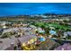 Picturesque aerial view capturing lush community, golf course, scenic mountains, and luxurious homes at 47 Strada Principale, Henderson, NV 89011