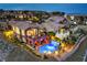 Stunning aerial view of a residence with a backyard pool, patio, and balcony overlooking manicured landscaping at 47 Strada Principale, Henderson, NV 89011