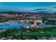 Breathtaking aerial view of a luxury resort community nestled among mountains and golf courses at 47 Strada Principale, Henderson, NV 89011