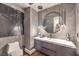 Stylish bathroom featuring a modern vanity, unique mirror, and contemporary design elements at 47 Strada Principale, Henderson, NV 89011