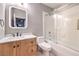 Modern bathroom with marble countertop, wood cabinets, and walk-in shower with glass doors at 47 Strada Principale, Henderson, NV 89011